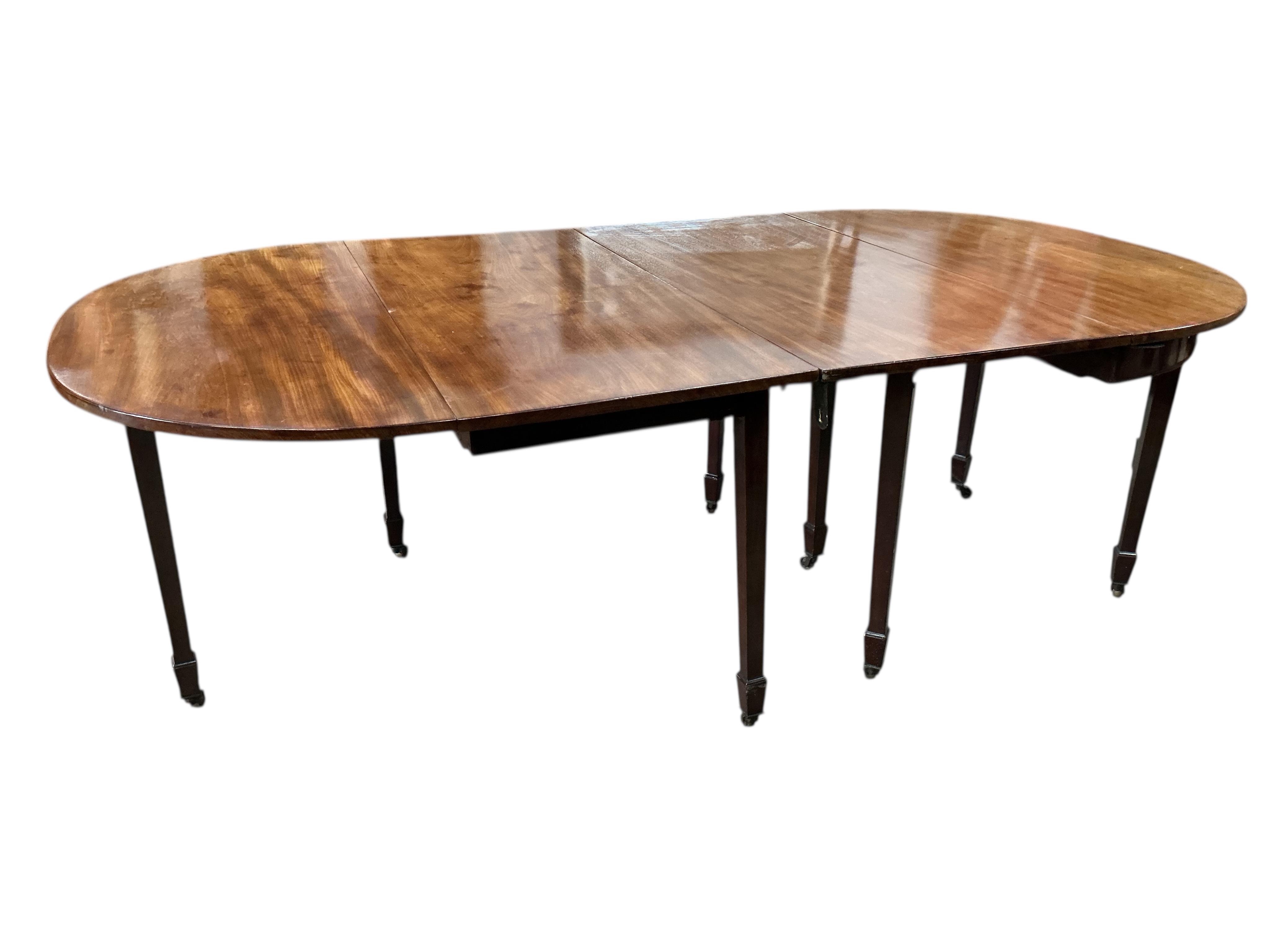 A George III and later mahogany D end extending dining table, width 217cm extended, one spare leaf, depth 122cm, height 76cm